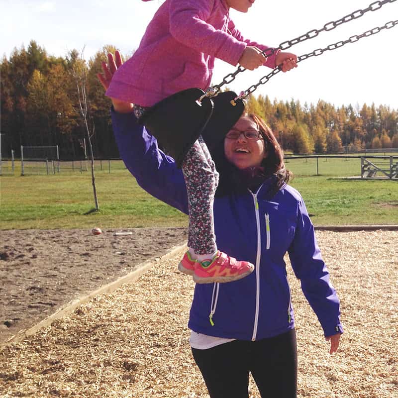 Me at the park pushing my daughter on the swing